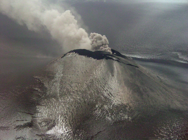 Veniaminof intracaldera cinder cone. Ash plume drifting to NE. Photo taken from a Navajo (Security Aviation) during an observational overflight. Elevation of cone is 7075 ft.
